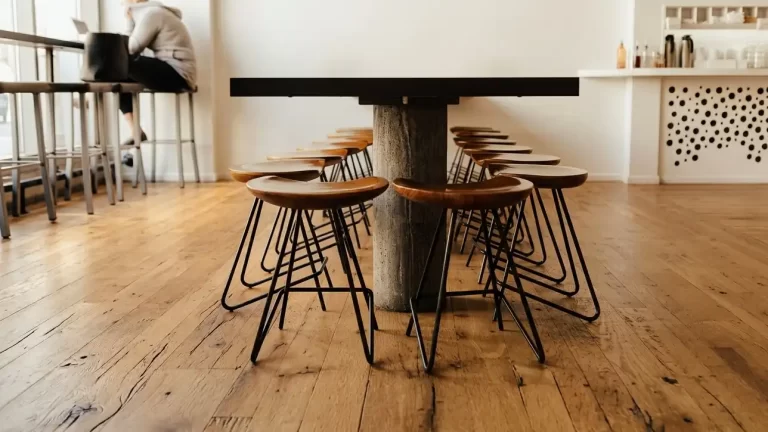 Reclaimed Oak flooring with wide plank flooring and original saw marks in a modern sunlit cafe.