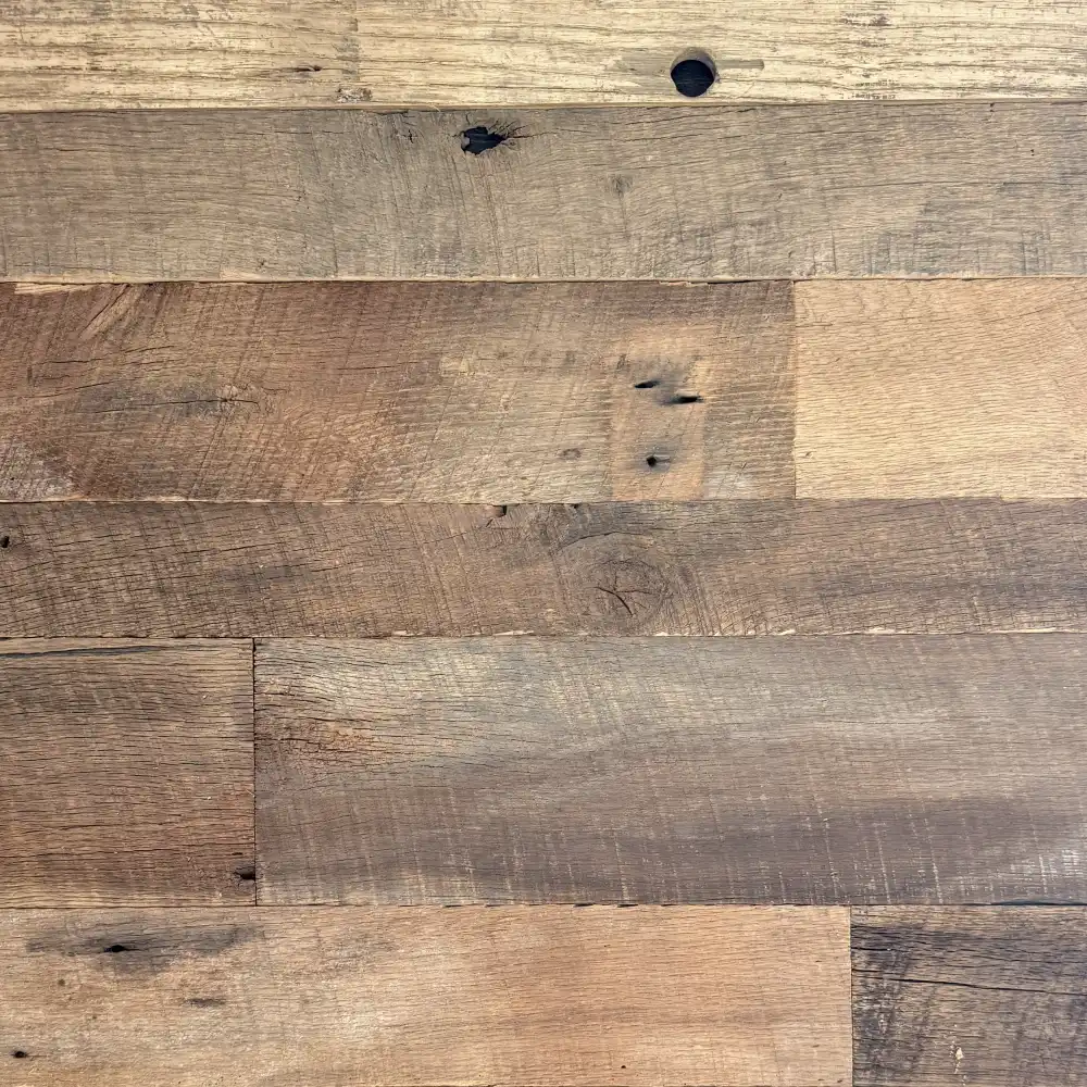 A group of several reclaimed barn wood planks displayed as horizontal planks. See how these authentic barn wood planks can make any space warm and inviting.