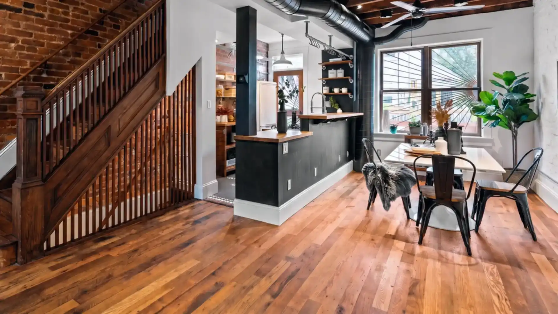 Reclaimed oak flooring, featuring the natural textures and character marks of aged lumber, offers a unique and durable flooring solution.