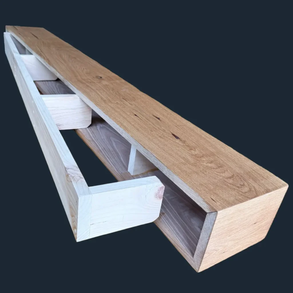 Hollow custom wood fireplace mantel revealing the internal hidden wall mounting bracket.