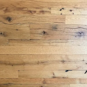 Reclaimed Oak Flooring showing authentic character such as checking, knots, insect scarring and nail holes.