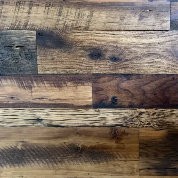 Antique mixed Hardwood flooring detail shot showing the hit and miss planing on the faces of the planks.