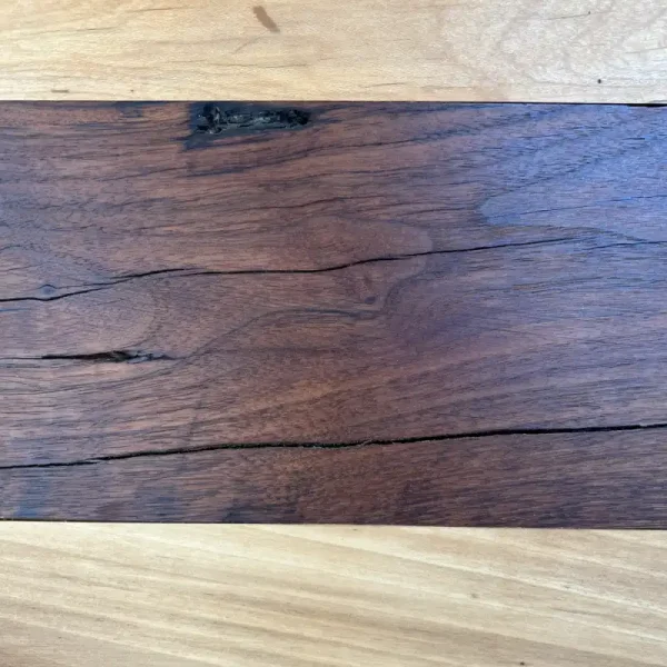 A closeup of Antique Mixed Hardwood flooring showing aging stress cracks