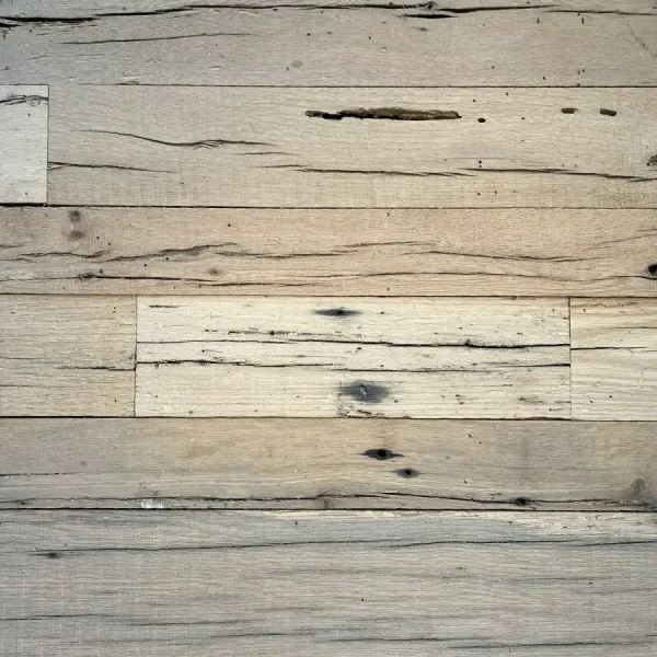 Detailed surface view of precision-milled reclaimed oak wall planks, showcasing the smooth but storied texture of the beam-sawn wood.