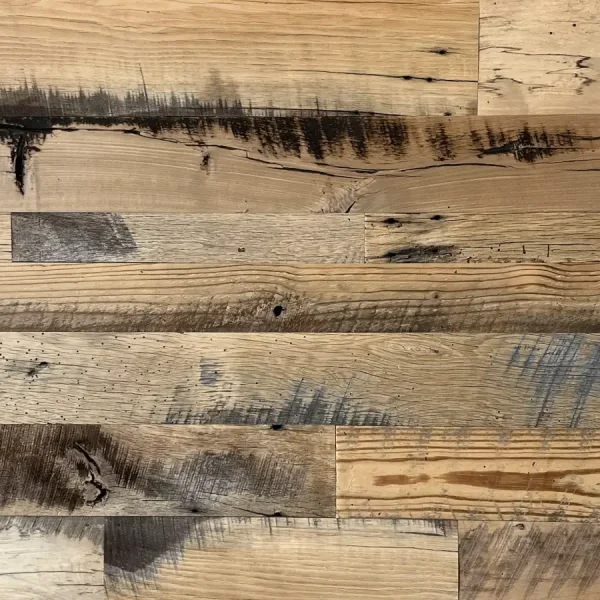 Close-up of skip planed reclaimed wood planks emphasizing the rich tactile finish and mixed-tone grain.