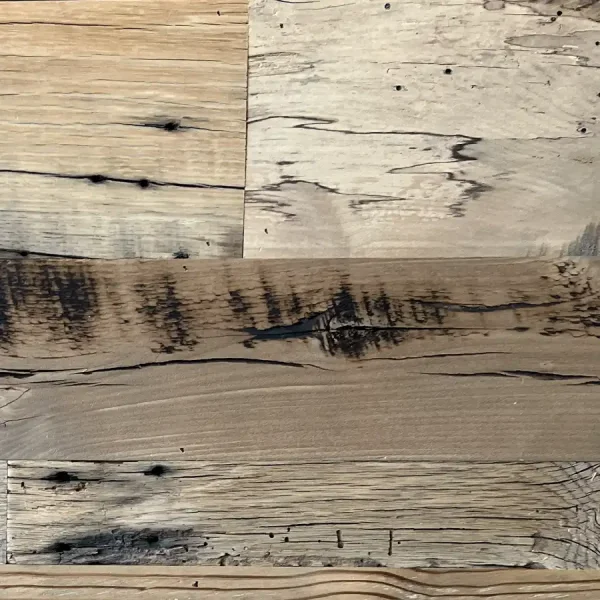 Close-up of skip planed reclaimed wood planks highlighting authentic original fastener marks such as nail and bolt holes.