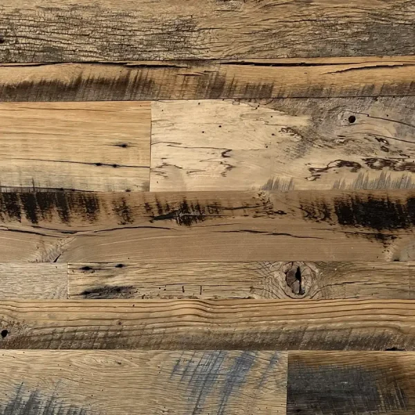 Close-up of skip planed reclaimed wood planks highlighting historic checking and aging stress cracks.