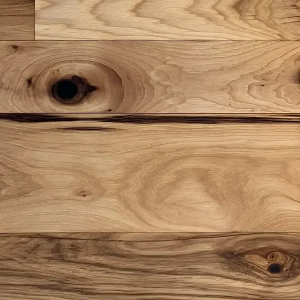 Rustic hickory flooring close-up shot showing mineral streaks and tonal depth.
