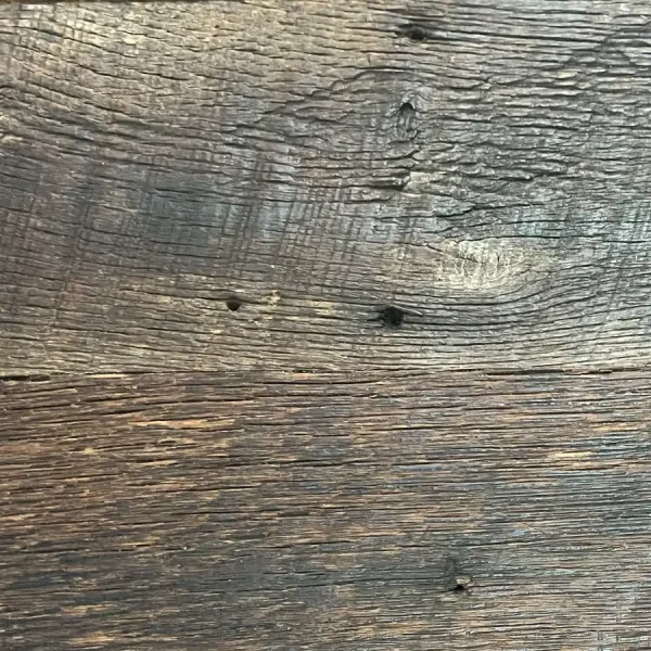 Close-up of original face oak flooring highlighting authentic original fastener marks and nail holes.